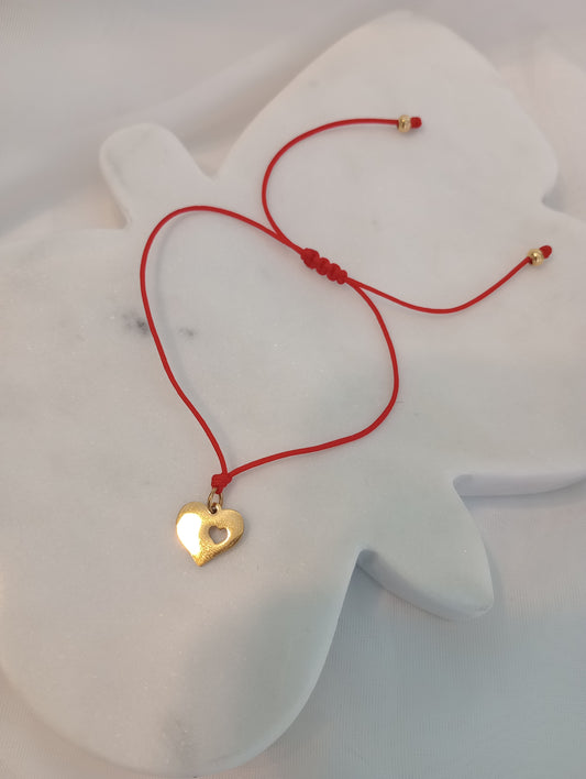 Corazón hilo rojo
